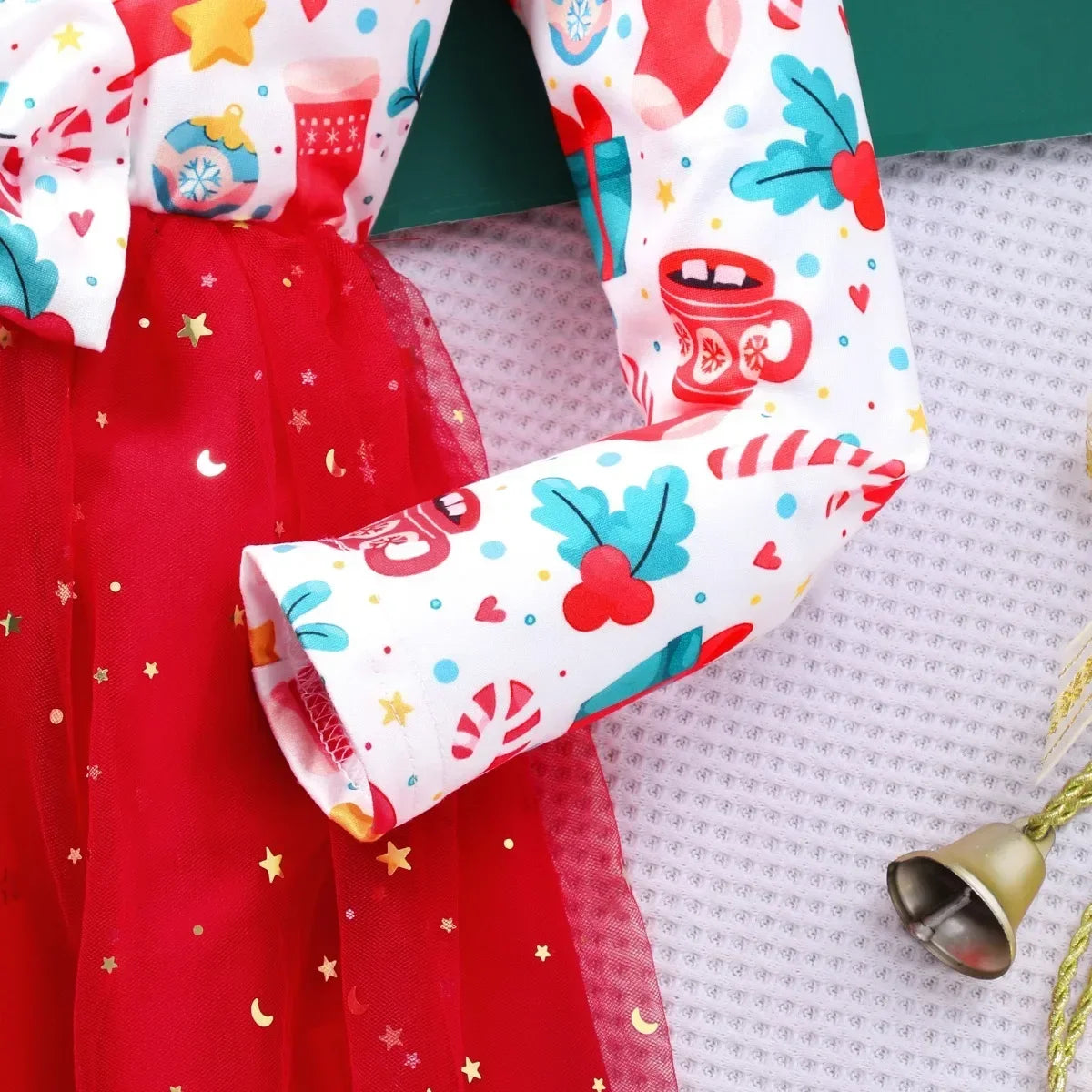long sleeve detail of girls christmas bow red dress showing cozy fit for winter celebrations