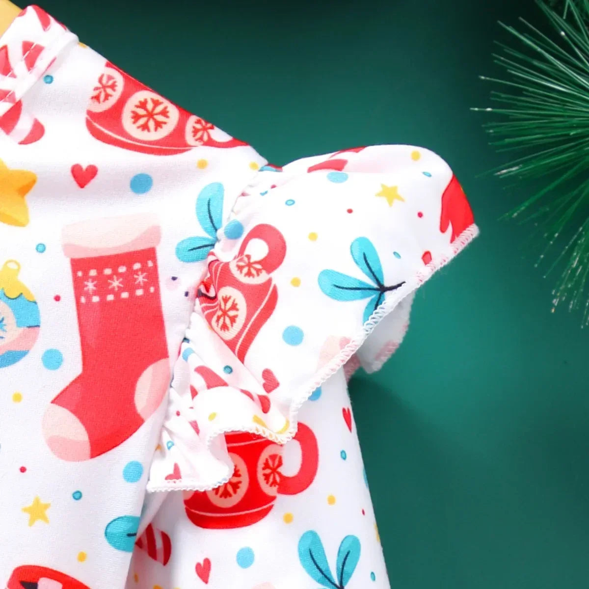close-up of winged shoulder ruffle on girls christmas a-line dress,  festive holiday outfit detail for kids
